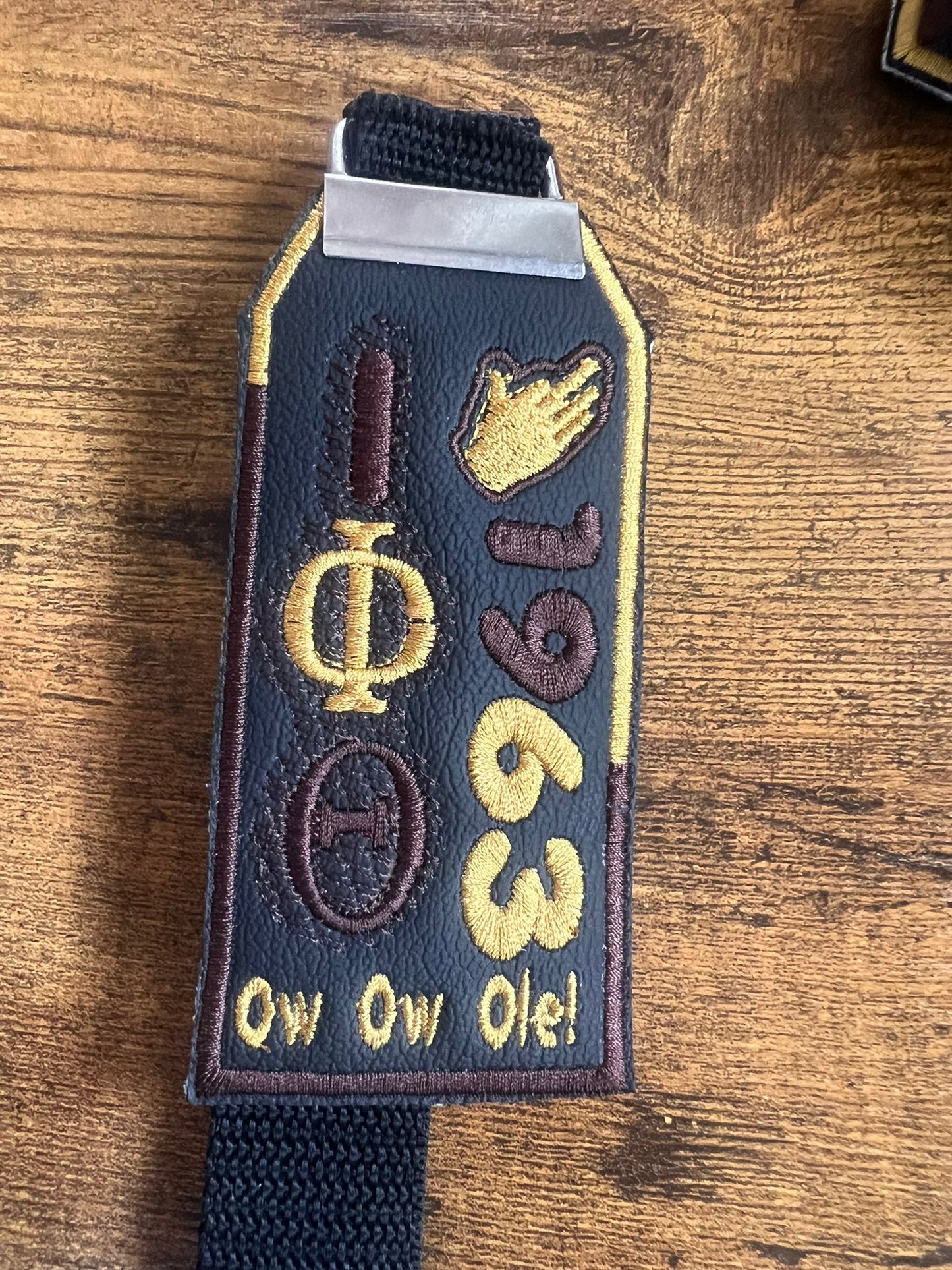 Iota Phi Theta Bag Tag (Brown/Gold Border)/Gold Hand/Strap
